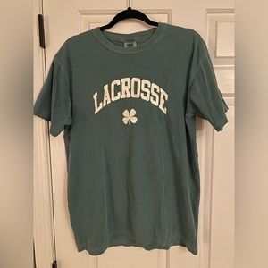 Green women’s lacrosse shirt